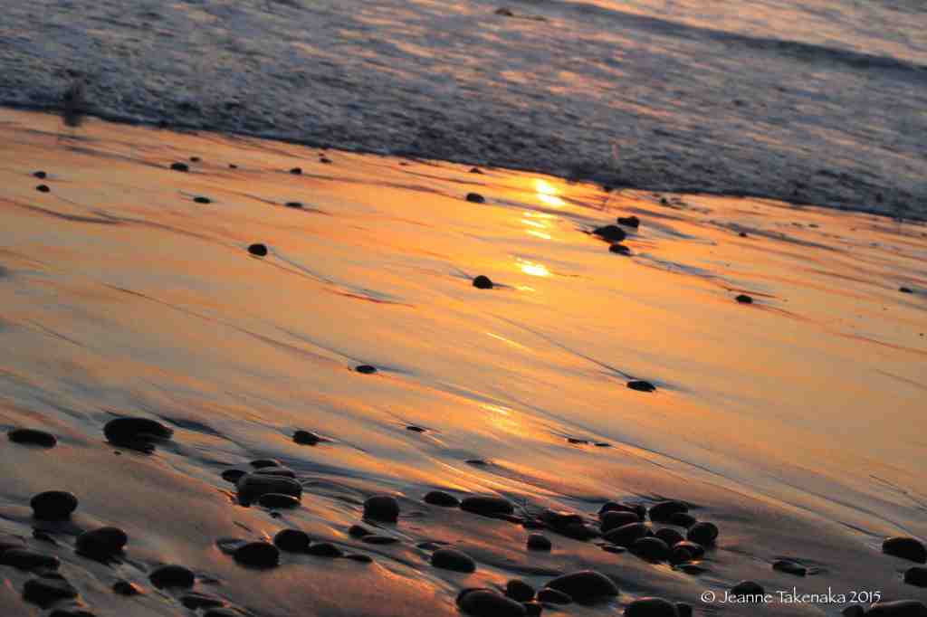 Beach stones at sunset